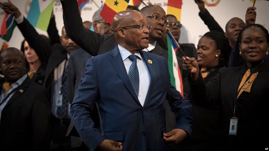 FILE - South African President Jacob Zuma, center, gathers with delegates at the opening session of the AU summit in Johannesburg, June 14, 2015. 