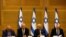 FILE - Avigdor Lieberman, from left, Benny Gantz, Yair Lapid and Israel's new prime minister Naftali Bennett hold a first cabinet meeting in Jerusalem. 