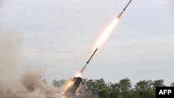 This picture taken on Aug. 27, 2024 and released from North Korea's official Korean Central News Agency (KCNA) via KNS on Aug. 28, 2024 shows a test-fire of the 240mm rocket artillery weapon system at an undisclosed location in North Korea.