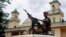 Soldiers from the Seleka rebel alliance stand guard as the Central African Republic's new President Michel Djotodia (not pictured) attends Friday prayers at the central mosque in Bangui, Mar. 29, 2013. 