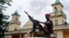 Soldiers from the Seleka rebel alliance stand guard as the Central African Republic's new President Michel Djotodia (not pictured) attends Friday prayers at the central mosque in Bangui, Mar. 29, 2013. 