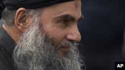  Abu Qatada arrives back at his residence in London after being freed from prison, November 13, 2012. 