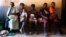 In this photo taken Thursday, March 21, 2019, mothers wait to have their babies vaccinated against measles, at a healthcare center in Larintsena, Madagascar. (AP Photo/Laetitia Bezain) 