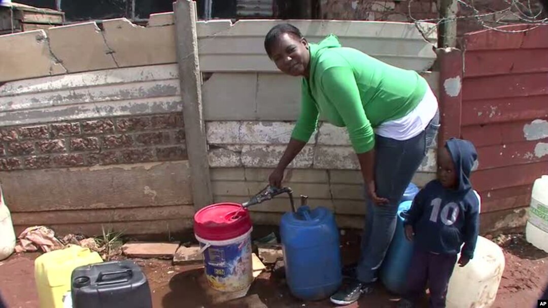Emily Ntake pumps water in South Africa's Makause community