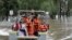 People prepared to disembark after rescuers ferried them across the flooded Hawkesbury River in Windsor, New South Wales, northwest of Sydney on March 25, 2021.