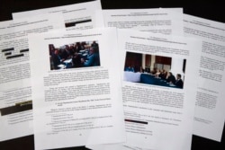 Special counsel Robert Mueller's redacted report on the investigation into Russian interference in the 2016 presidential election is photographed, April 18, 2019, in Washington.