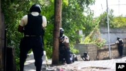 Police search the Morne Calvaire district of Petion Ville for suspects who remain at large in the killing of Haitian President Jovenel Moise in Port-au-Prince, Haiti, July 9, 2021. 