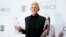 Ellen DeGeneres poses backstage with her Humanitarian Award and Award for Favorite Daytime TV Host during the People's Choice Awards 2016 in Los Angeles, California, Jan. 6, 2016. 