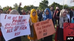 Students display placards during a demonstration demanding for reinstatement of student unions, education fee cuts and batter education facilities, in Islamabad on Nov. 29, 2019.