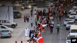 Bahraini anti-government protesters form a human chain Saturday, March 5, 2011, stretching about seven kilometers (four miles) around Manama, Bahrain, from the country's main Fateh Mosque to the Pearl roundabout