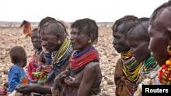 Turkana women wait for food relief at Kalok Tonyang in the Turkana district northwest of Nairobi, August 9, 2011.