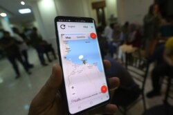 A journalist shows application "Kon Chahed" (Be a witness), which aims to protect reporters by providing them with a safe way to document attacks, at the Libyan Center for Freedom of Press (LCFP) in Tripoli, Aug. 14, 2019.