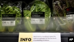 FILE - A sign warning of lettuce shortages is displayed in a supermarket in London, Feb. 3, 2017. 