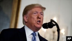 President Donald Trump speaks about the mass shootings in El Paso, Texas and Dayton, Ohio, in the Diplomatic Reception Room of the White House in Washington, Aug. 5, 2019.