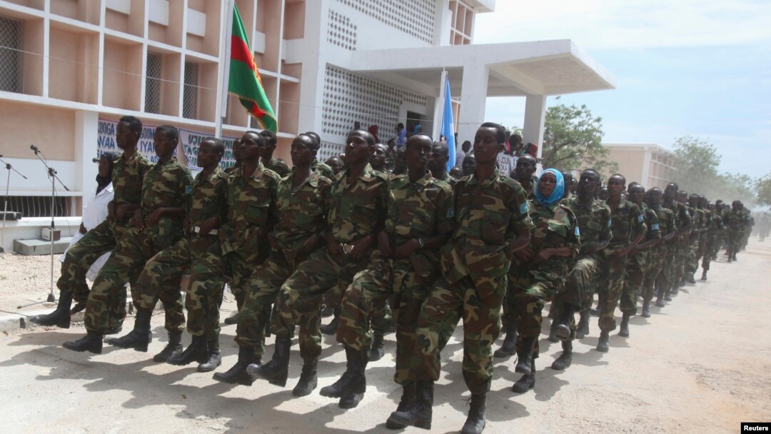 Somali government forces march during a parade to celebrate the 53rd anniversary of the national army, in the capital Mogadishu, April 12, 2013.