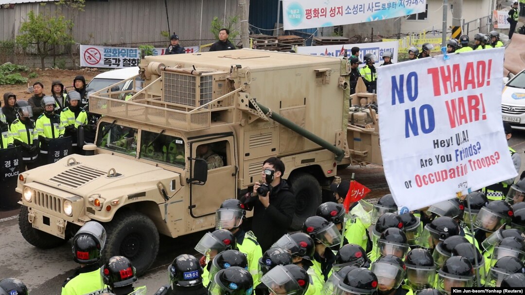 FILE - A U.S. military vehicle, which is a part of Terminal High Altitude Area Defense (THAAD) system, arrives in Seongju, South Korea, April 26, 2017. A South Korean official said Friday the decision to delay full deployment will ensure a democratic process.