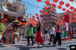 FILE - Chinese tourists tour Pung Tao Gong Chinese Temple in Chiang Mai province, northern Thailand, on Jan. 23, 2023.