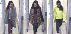 FILE - In this three image combo of stills taken from CCTV issued by the Metropolitan Police in London, Feb. 23, 2015, Kadiza Sultana, 16, left, Shamima Begum, 15, center and 15-year-old Amira Abase go through security at Gatwick airport.