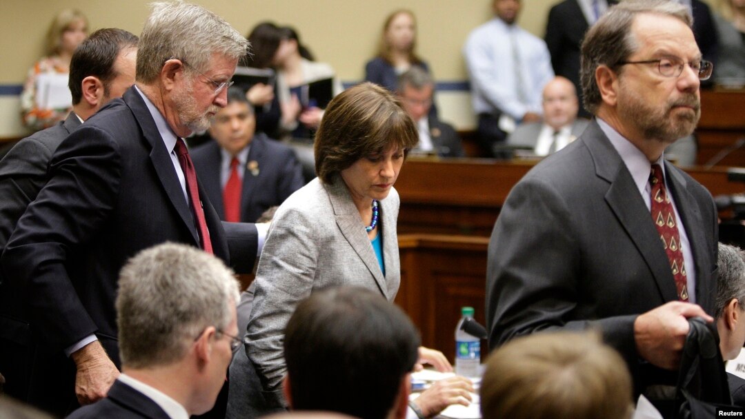 Director of Exempt Organizations for the Internal Revenue Service Lois Lerner (C) departs with her legal team after being excused from a House Oversight and Government Reform Committee hearing on targeting of political groups seeking tax-exempt status fro