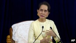 Myanmar leader Aung San Suu Kyi speaks during literacy talks with university students at the convocation hall of Yangon university Tuesday, Aug. 28, 2018, in Yangon, Myanmar.