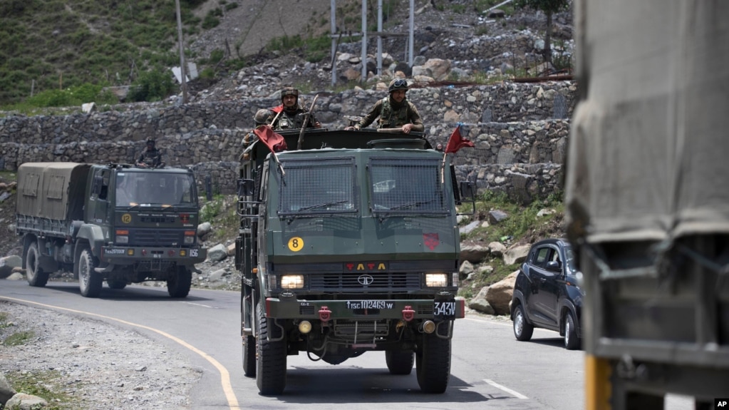 An Indian army convoy moves on the Srinagar- Ladakh highway at Gagangeer, north-east of Srinagar, India, Wednesday, June 17, 2020. 