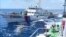 FILE - Screen grab shows the Chinese Coast Guard ship 46001 (L) chasing a Vietnamese vessel near to the site of the Chinese oil rig in the disputed waters in the South China Sea, off Vietnam's central coast. 