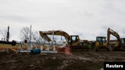 FILE - A Natural Gas rig operated by Chesapeake is pictured in Bradford County, Pennsylvania just outside the town of Wyalusing on January 13, 2013. 