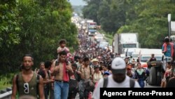 Migrants heading in a caravan to the U.S., walk towards Mexico City to request asylum and refugee status in Villa Comaltitlan, Chiapas State, Mexico.