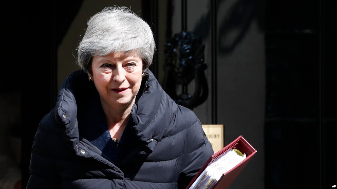 FILE - Britain's Prime Minister Theresa May leaves 10 Downing Street for the House of Commons for her weekly Prime Minister's questions in London, May 1, 2019.