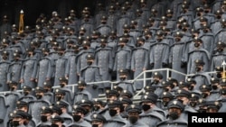 U.S. Army cadets wearing protective masks stand at Michie Stadium ahead of the annual Army-Navy collegiate football game, in West Point, New York, Dec. 12, 2020.