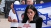 A person reacts as family members and supporters of hostages deliver statements for the release of hostages who were kidnapped during the deadly October 7, 2023 attack by Hamas, n Tel Aviv, Jan. 17, 2025.