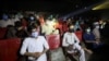 People wear protective masks while watching a movie at a cinema in Peshawar after Pakistan lifted lockdown restrictions, as the coronavirus disease (COVID-19) outbreak continues, Aug. 10, 2020.