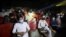 People wear protective masks while watching a movie at a cinema in Peshawar after Pakistan lifted lockdown restrictions, as the coronavirus disease (COVID-19) outbreak continues, Aug. 10, 2020.