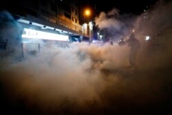 A man is seen after riot police fired tear gas after a sit-in at Yuen Long to protest against violence two months ago when white-shirted men wielding pipes and clubs wounded anti-government protesters and passers-by, in Hong Kong, Sept. 21, 2019.
