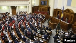 Lawmakers applaud after scrapping Ukraine's "non-aligned" status during a session of parliament in Kyiv, Dec. 23, 2014. 