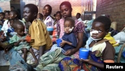 Malnourished Malawian children sit with their mothers at a feeding center at the Zomba Central Hospital 60 km's north of Blantyre (file photo). 