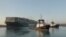 A view shows the container ship Ever Given, one of the world's largest container ships, after it was partially refloated, in Suez Canal, Egypt, March 29, 2021. 