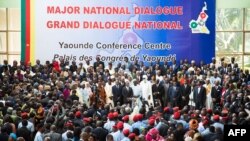 People gather at the Congress Palace during the opening session of the National Dialogue called by President Paul Biya, in Yaounde, Cameroon, Sept. 30, 2019. 