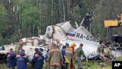 Emergency Ministry members work at the site of the Tupolev-134 plane crash outside the northern Russian city of Petrozavodsk, June 21, 2011