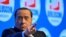 FILE PHOTO: Former Italian prime minister Silvio Berlusconi gestures during a campaign rally