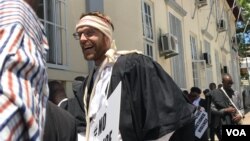 Zimbabwe lawyer Douglas Coltart joins fellow lawyers during a protest against police brutality, while marching from the High Court to the Ministry of Home Affairs where they submitted their petition in Harare, on November 29, 2019. 