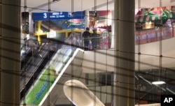 Two soldiers are seen inside Terminal 21 Korat mall in Nakhon Ratchasima, Thailand, Feb. 9, 2020. A soldier who holed up in the popular shopping mall shot multiple people on Saturday.
