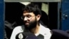 FILE- Ahmed Omar Saeed Sheikh, the alleged mastermind behind Wall Street Journal reporter Daniel Pearl's kidnap-slaying, appears at the court in Karachi, Pakistan, March 29, 2002.