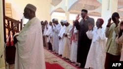 FFILE - An imam leads prayers at the Great Mosque in Maroua's Dougoi district, northern Cameroon, Nov. 20, 2013.