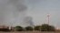 FILE: Smoke rises in Khartoum, Sudan, on Sun. June 4, 2023. 