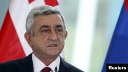 The Armenian opposition says the changes voted on Sunday are a ruse to let President Serzh Sarksyan, pictured in October in Tbilisi, Georgia, take on an enhanced prime ministerial role at the end of his presidential term in 2018.