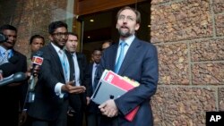 U.N.High Commissioner for Human Rights Zeid Raad al-Hussein, right, speaks to media as he leaves a hotel in Colombo, Sri Lanka, Feb. 6, 2016. 