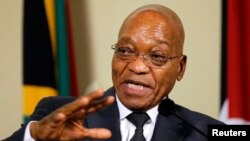 FILE - South Africa's President Jacob Zuma gestures during a media briefing at the Union Building in Pretoria.