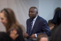 FILE - Former Ivory Coast president Laurent Gbagbo enters the courtroom at the International Criminal Court in The Hague, Netherlands, Jan. 15, 2019.