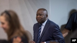 FILE - Former Ivory Coast president Laurent Gbagbo enters the courtroom at the International Criminal Court in The Hague, Netherlands, Jan. 15, 2019.